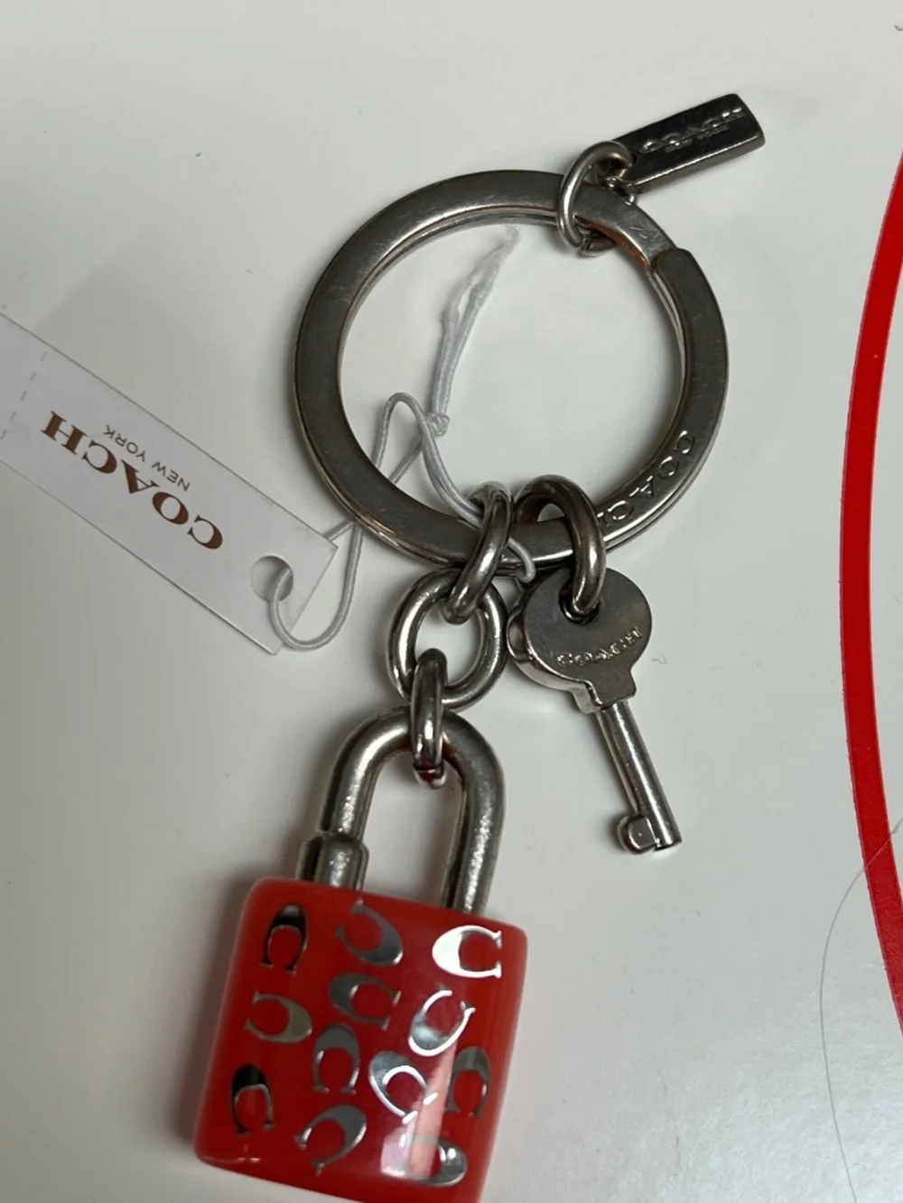 COACH LOCK AND KEY KEY RING  PURSE CHARM PINK AND SILVER NEW NWT (RETIRED) W/BOX